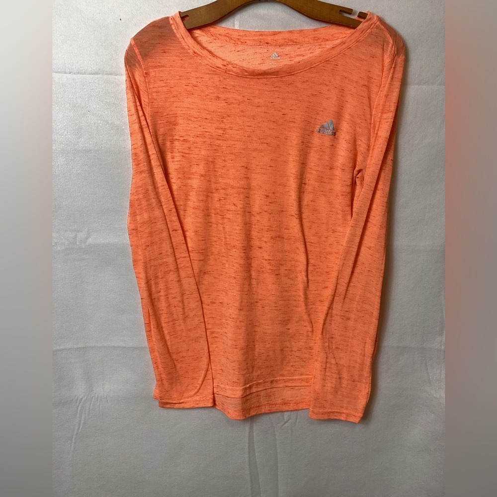 Adidas Women’s shirt size Large color orange.      (C)